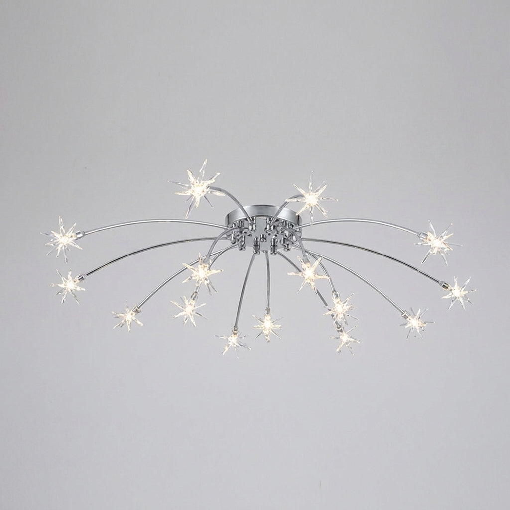 A modern semi-flush mount ceiling light fixture with a silver chrome base and multiple thin arms ending in glowing white starburst-shaped bulbs, shown against a plain light grey background.