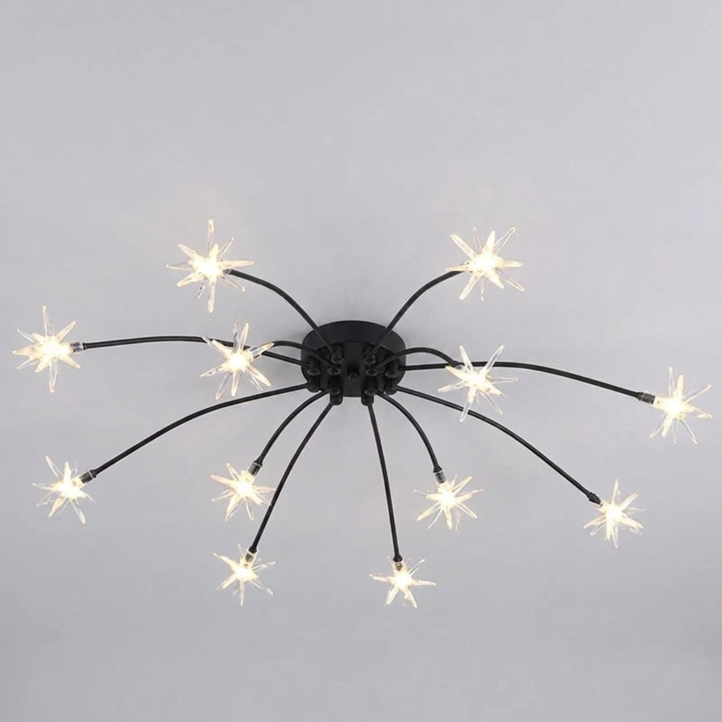 A modern ceiling light fixture with a black central canopy and multiple thin black arms extending outwards, each ending in a star-shaped bulb that glows with warm white light, shown against a plain light grey background.