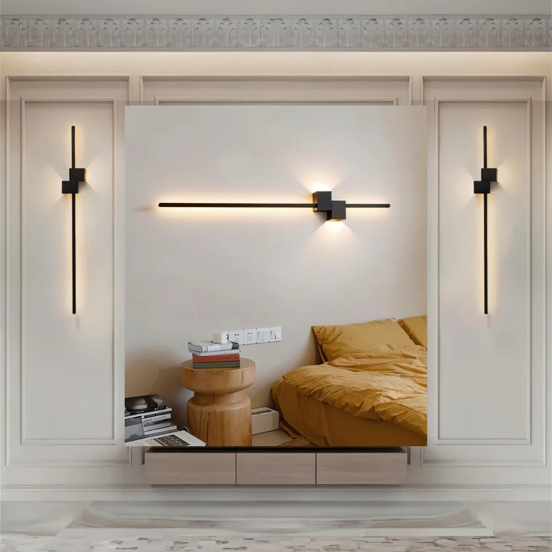Set of black aexi asymmetrical linear wall sconces mounted vertically and horizontally in a modern bedroom