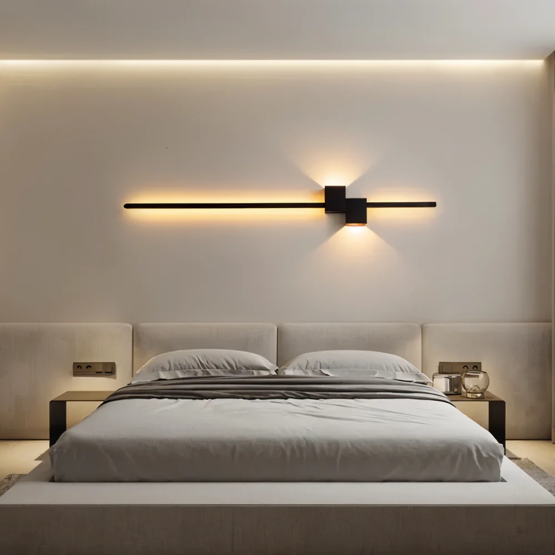 Horizontal black linear LED aexi wall sconce providing warm ambient light above a modern bed