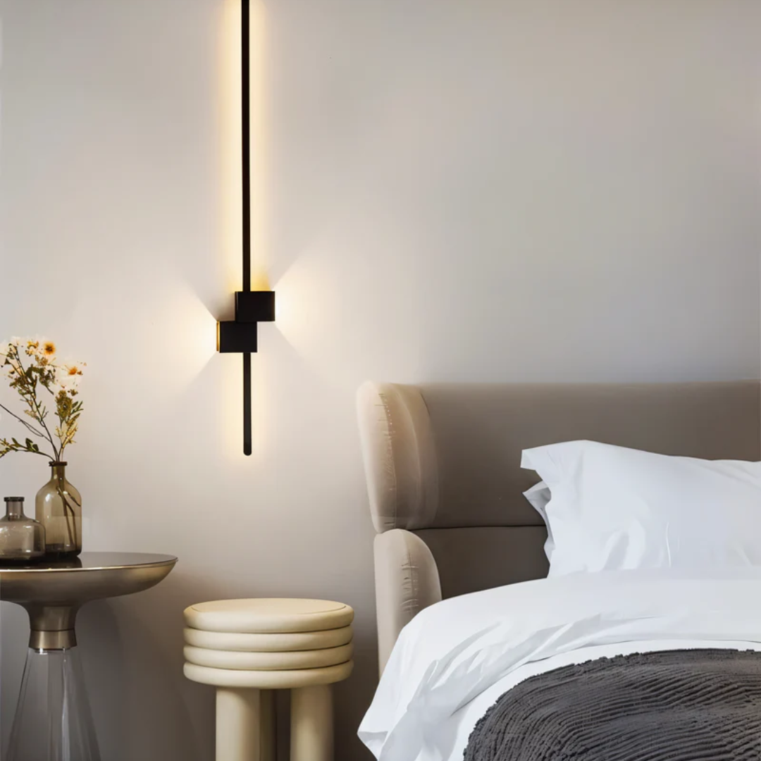 Vertical black geometric aexi wall lamp acting as an elegant ambient bedside accent light