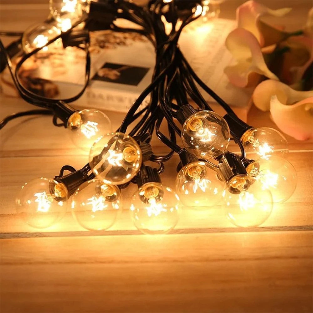 A bundle of Afqo string light bulbs laid out on a wooden table