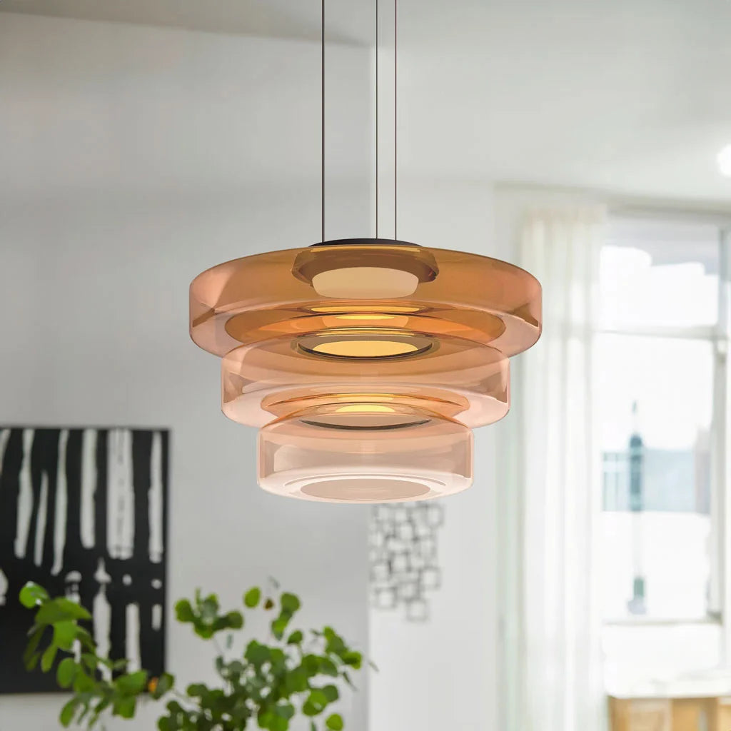 Large amber 3-layer tiered glass chandelier providing a striking mid-century focal point