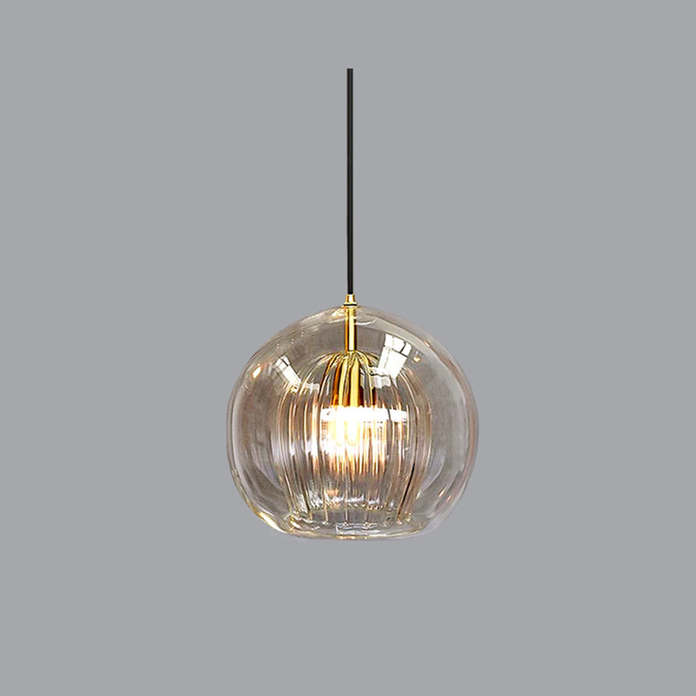 Amber tinted double-layer glass globe pendant isolated against a neutral grey background