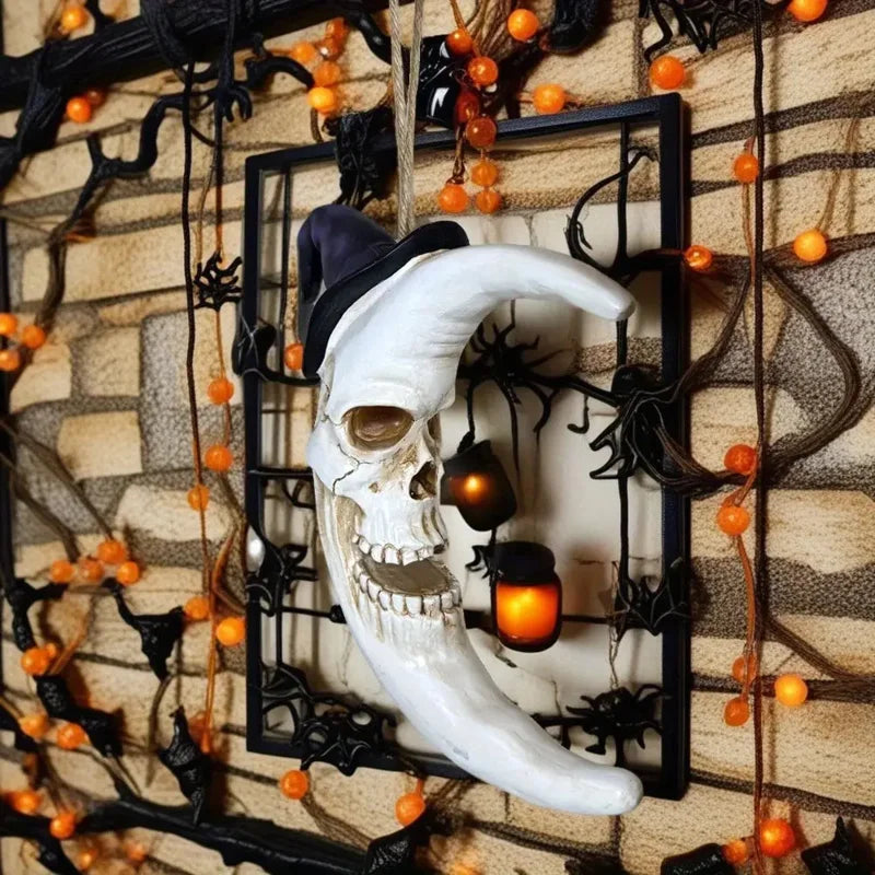 Astralvoid crescent moon skull close-up on black metal wall frame with lanterns and bead garland