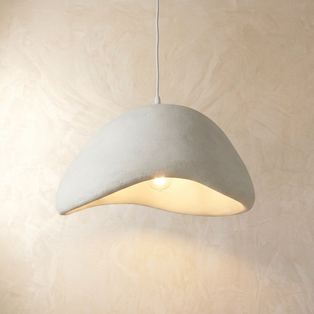 Asymmetrical white resin ceiling lamp illuminating with a soft ambient glow