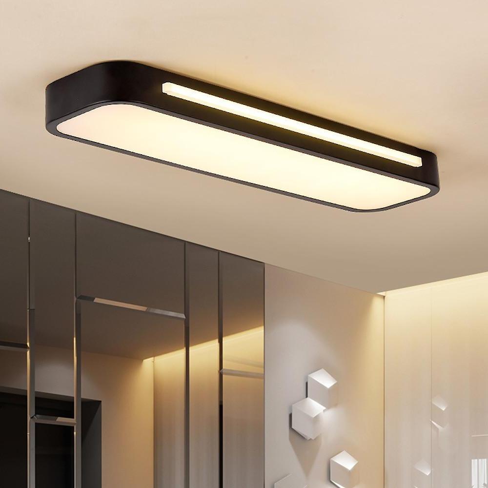 Ultra-thin black linear LED flush atio ceiling light installed in a modern interior space