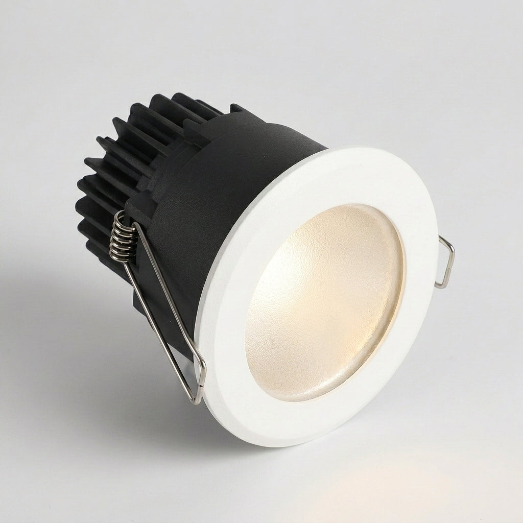 Aztil IP65 waterproof LED downlight, angled hero shot with warm light on