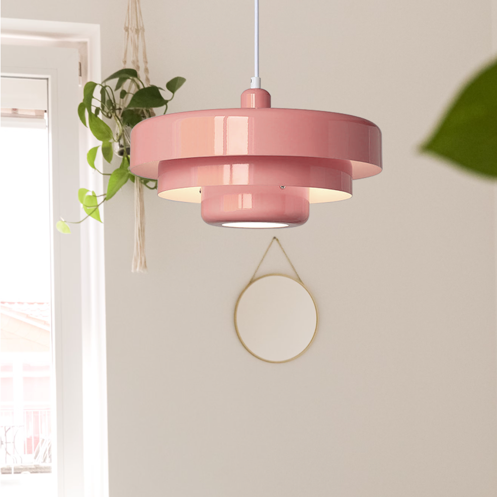 Soft pink layered metal balel pendant light adding a retro pastel touch to a bright, airy room