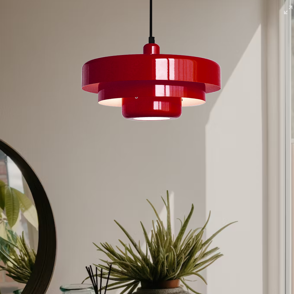 Bold red mid-century balel tiered pendant light hanging in a modern, naturally lit interior