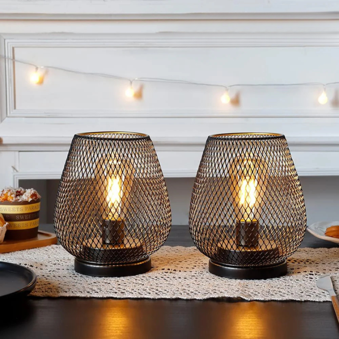 Battery-powered metal mesh table lamps casting a warm, romantic glow for an intimate dining setting