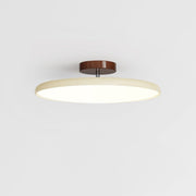 Modern beige adjustable LED flush mount ceiling light showcasing its sleek, low-profile design