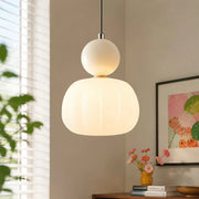 Beige Bauhaus macaron pendant light providing warm, diffused illumination in a modern room