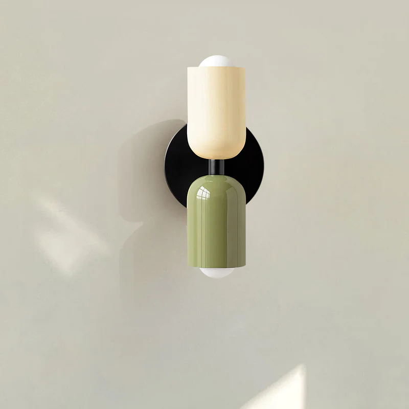 front view of the beige and green glass wall lamp showing the sleek black mounting bracket