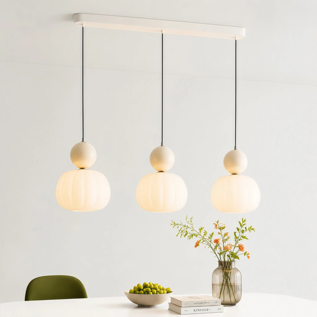 Beige three-head linear pendant cluster offering a soft, creamy minimalist aesthetic