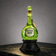 Bevvy witches brew LED glitter potion bottle studio shot on a stone surface