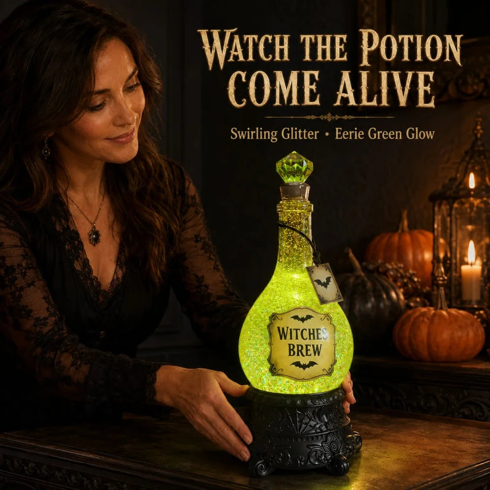Bevvy witches brew LED glitter potion bottle held on a table with pumpkins and candlelight