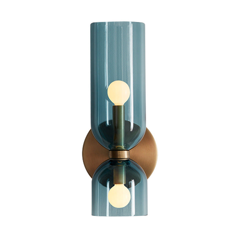 Isolated view of the bitlat blue capsule glass double-head wall lamp with brass-finished hardware