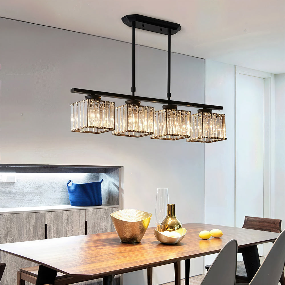 Black 4-light square ribbed glass pendant suspended over a long wooden dining table