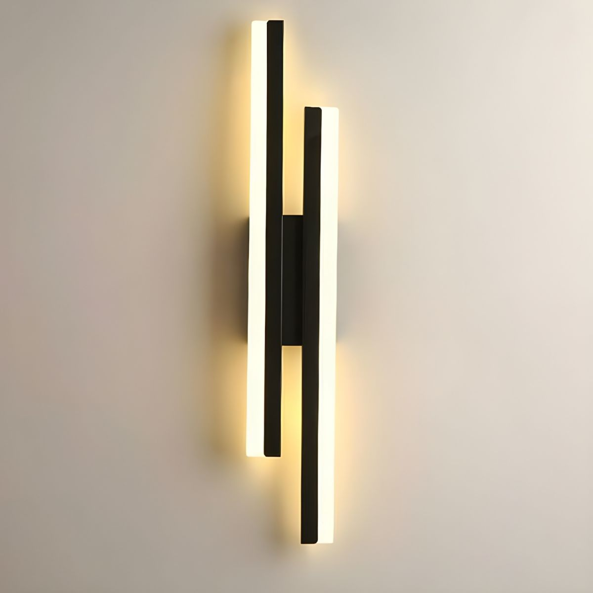 Glowing black asymmetrical LED wall light featuring a minimalist staggered acrylic design
