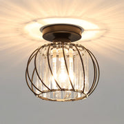 Modern black crystal cage flush mount ceiling light casting a dramatic starburst pattern