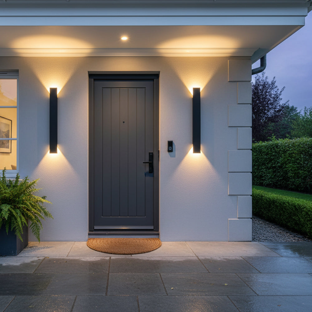 Pair of modern black LED porch lights beautifully framing a classic dark front door