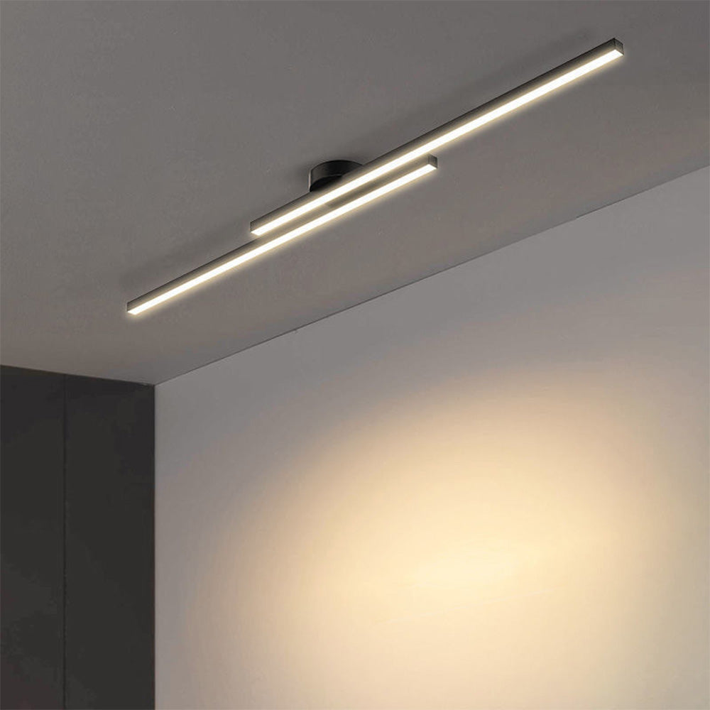 Modern black linear LED flush mount ceiling light casting a warm, inviting glow