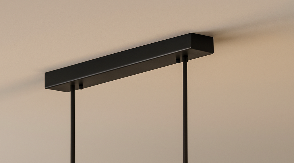 Close-up of the sleek black rectangular ceiling canopy and suspension cables for the linear LED pendant