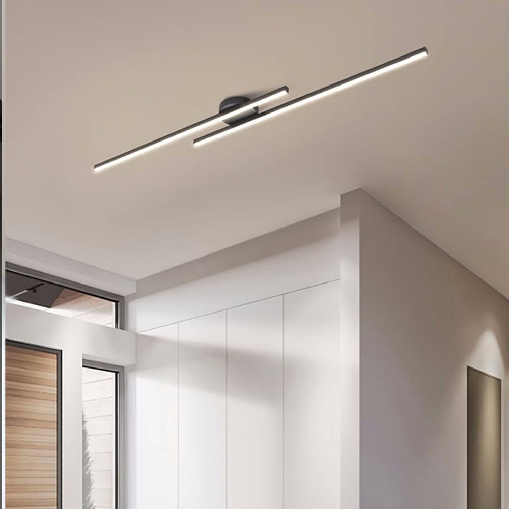 Black minimalist staggered ceiling lighting installed in a contemporary home corridor