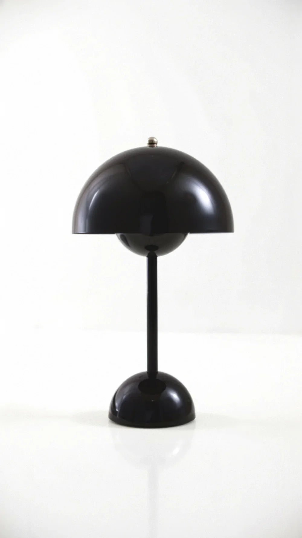 Sleek black minimalist cordless desk lamp offering a bold, contemporary look
