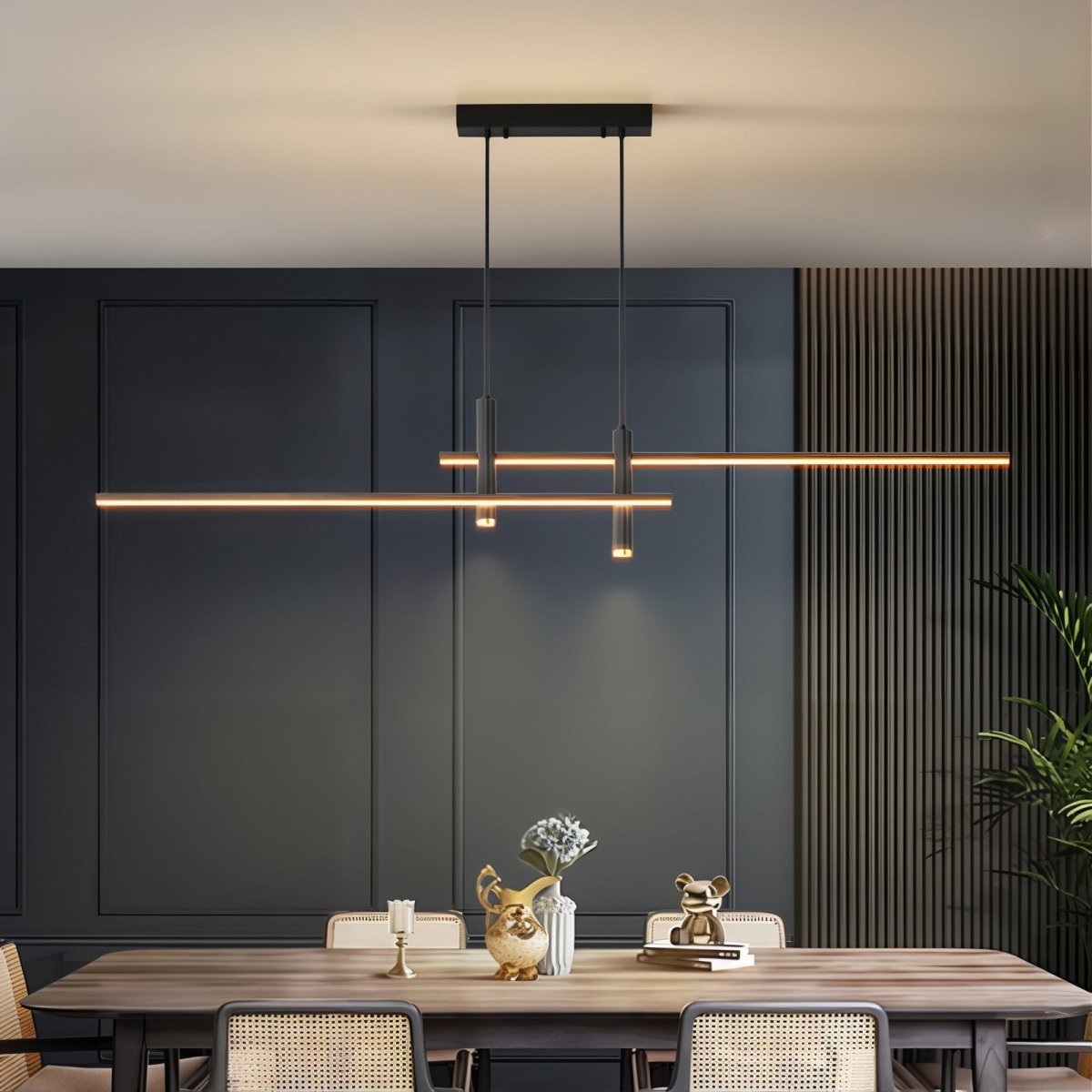 Minimalist black linear island chandelier illuminating a dark, sophisticated dining room interior