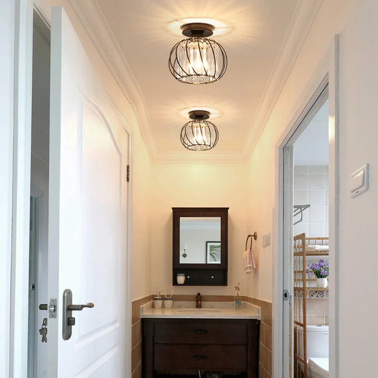 Black Nordic crystal cage ceiling lamp installed in a bright home entryway
