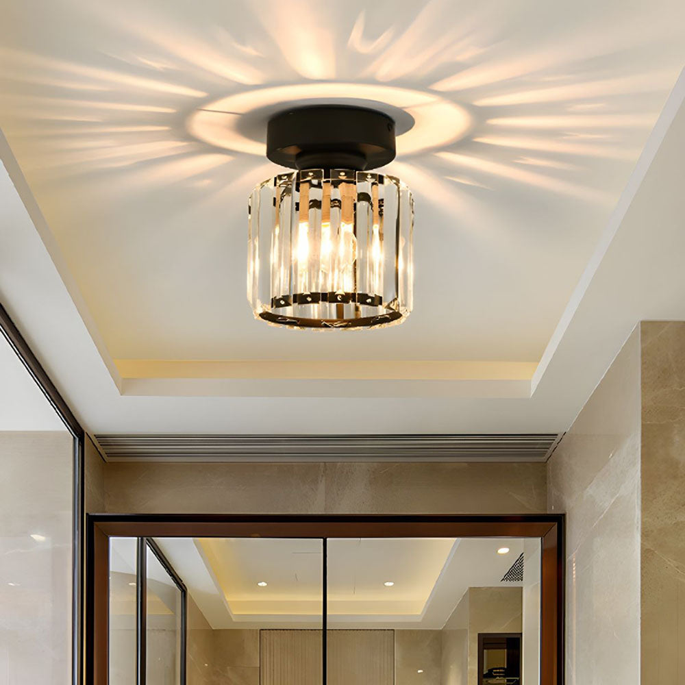 Modern black round crystal flush mount light in a minimalist home entryway