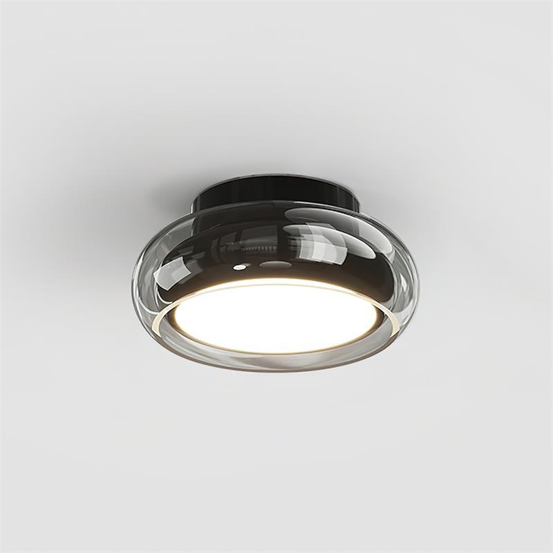 Sleek black base and smoke grey tinted glass flush mount ceiling light isolated on white
