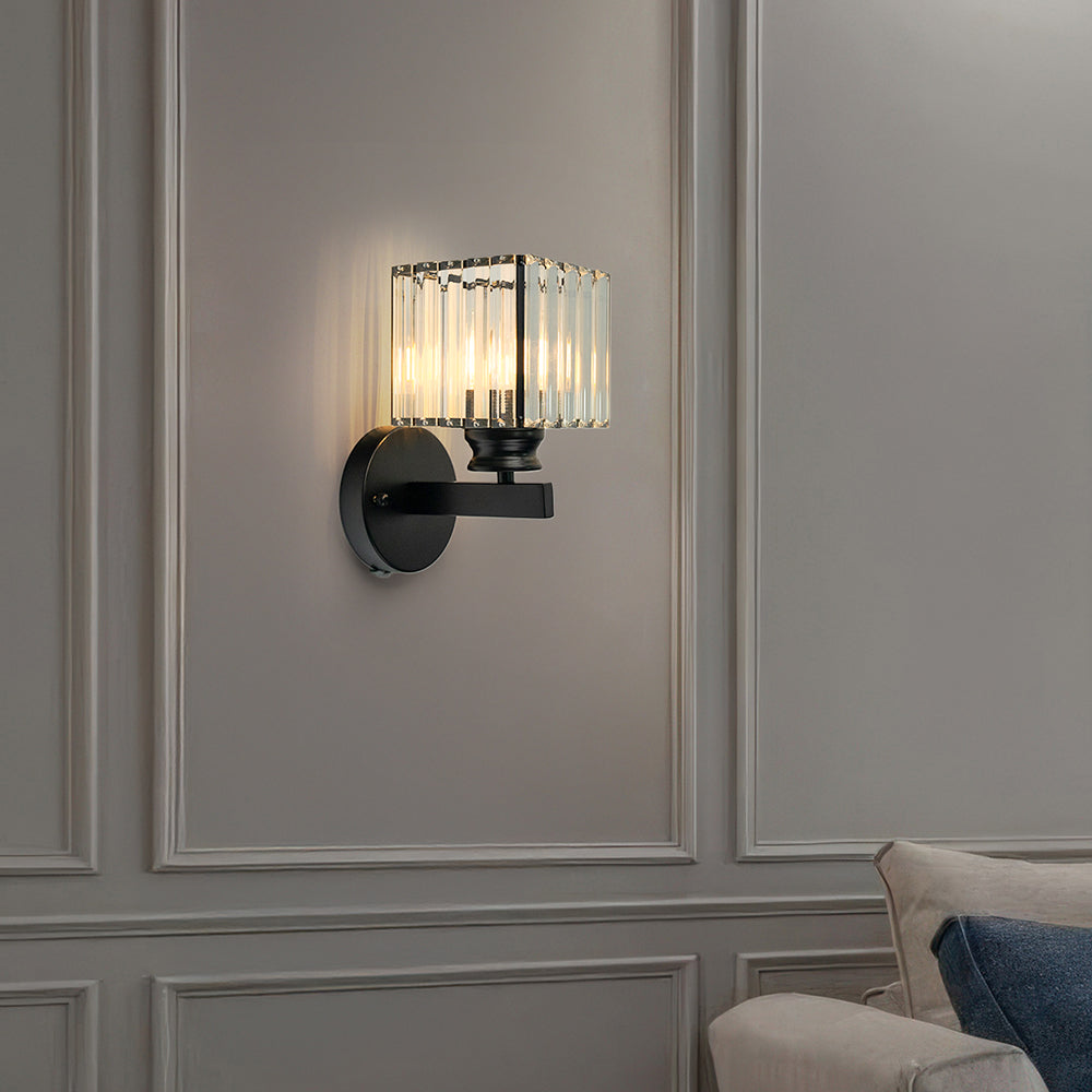 Black square crystal wall light adding luxury to a minimalist living room with panelled walls