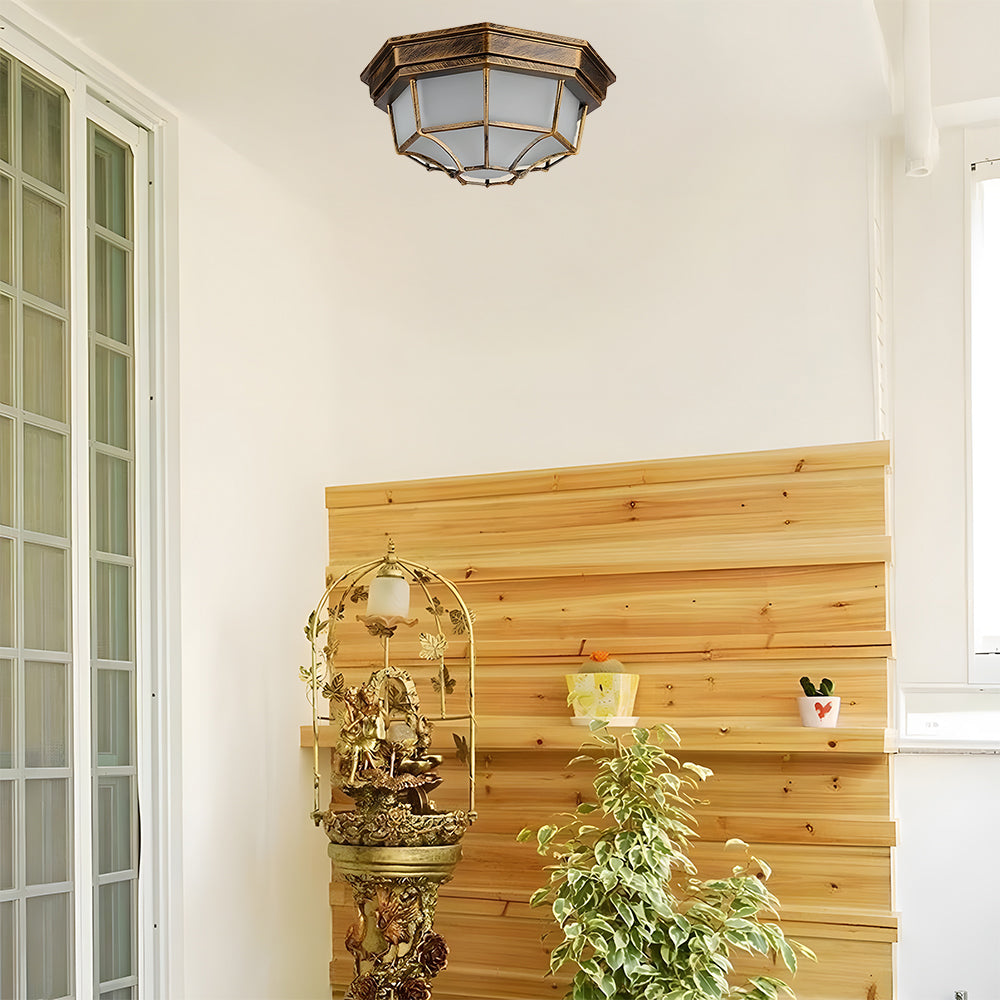 Bronze nautical flush mount light installed as stylish indoor ceiling lighting in a bright, wood-accented room