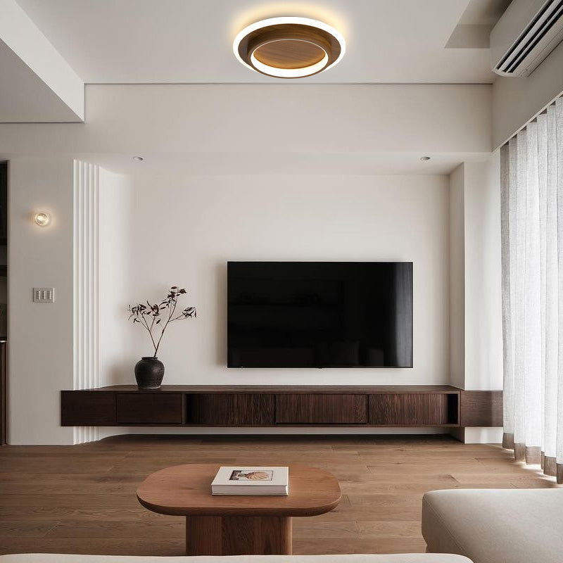 brown halo LED flush ceiling lamp installed in a contemporary living room above a television