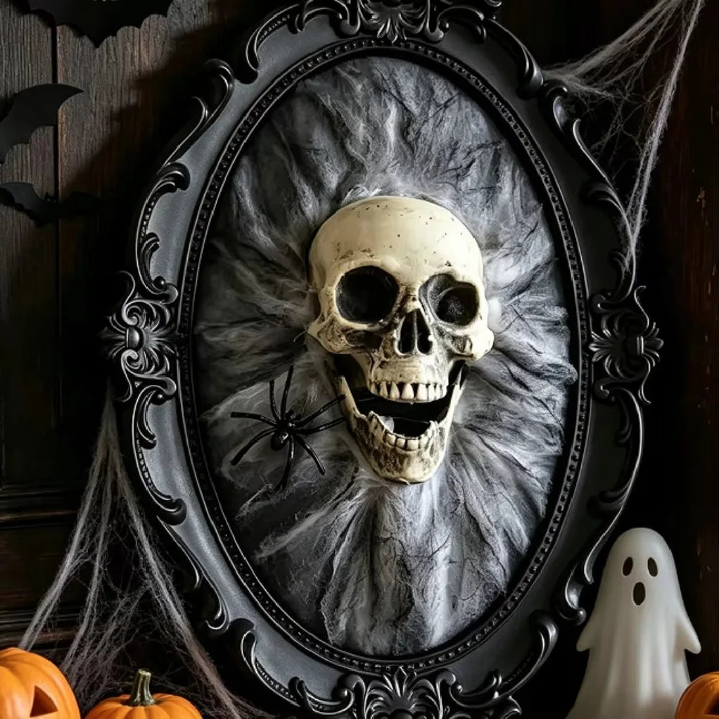 Cinder gothic skull wall plaque close-up showing the small spider accent on the web backdrop