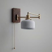 Cizqa walnut and copper swing arm wall light with ribbed ceramic shade and pull chain switch