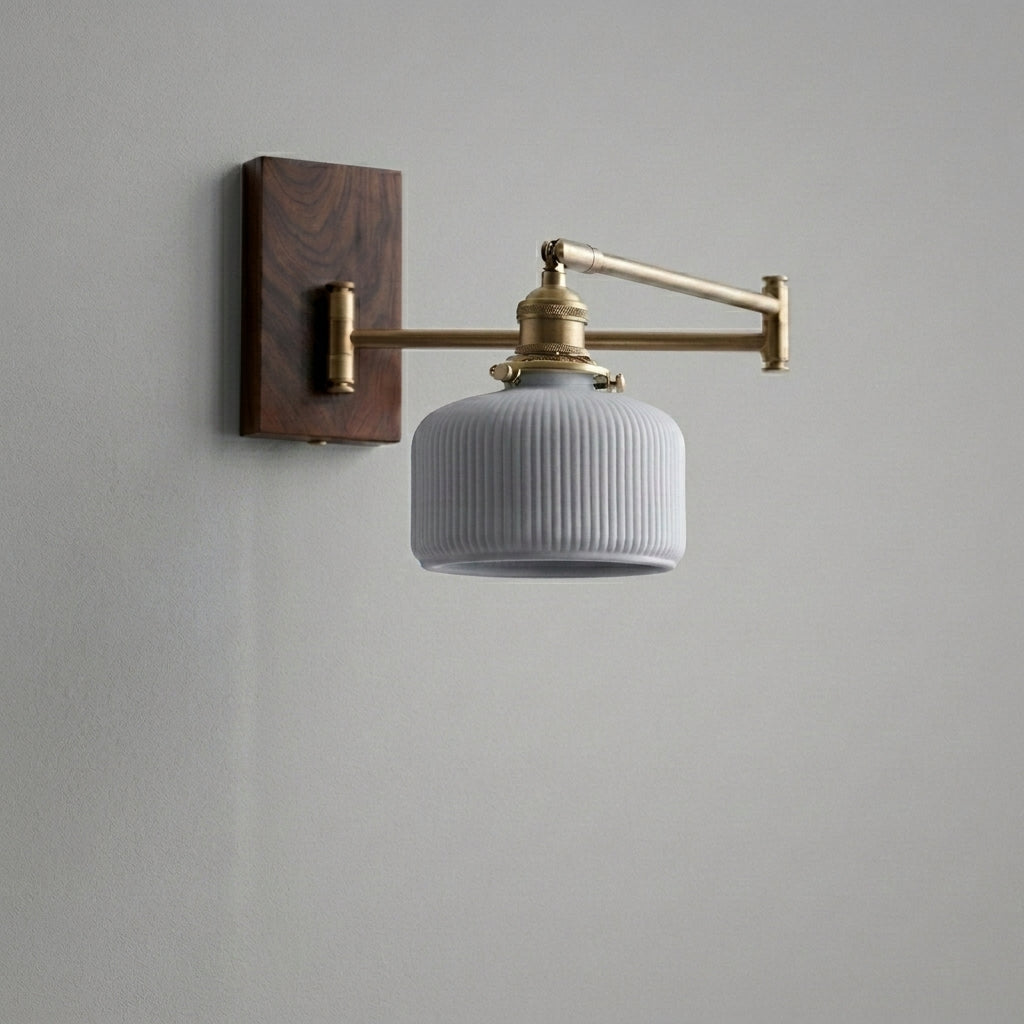 Cizqa swing arm wall light on a grey studio background, unlit