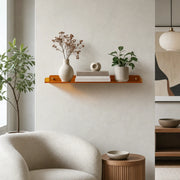 Cleft acrylic floating wall shelf, Orange, single shelf styled with vase and plant in a living room