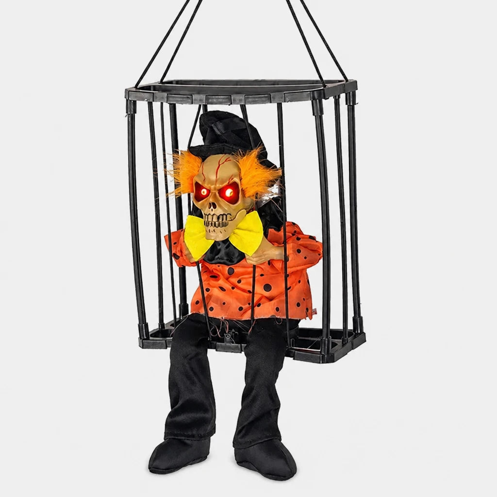 Croakley caged skeleton prop in orange-haired clown costume design, alternate view, on a plain studio background