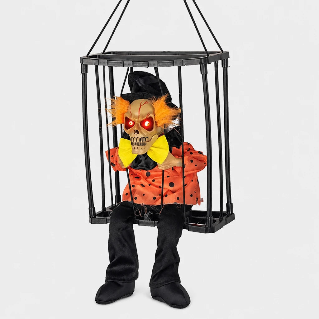 Croakley caged skeleton prop in orange-haired clown costume design on a plain studio background