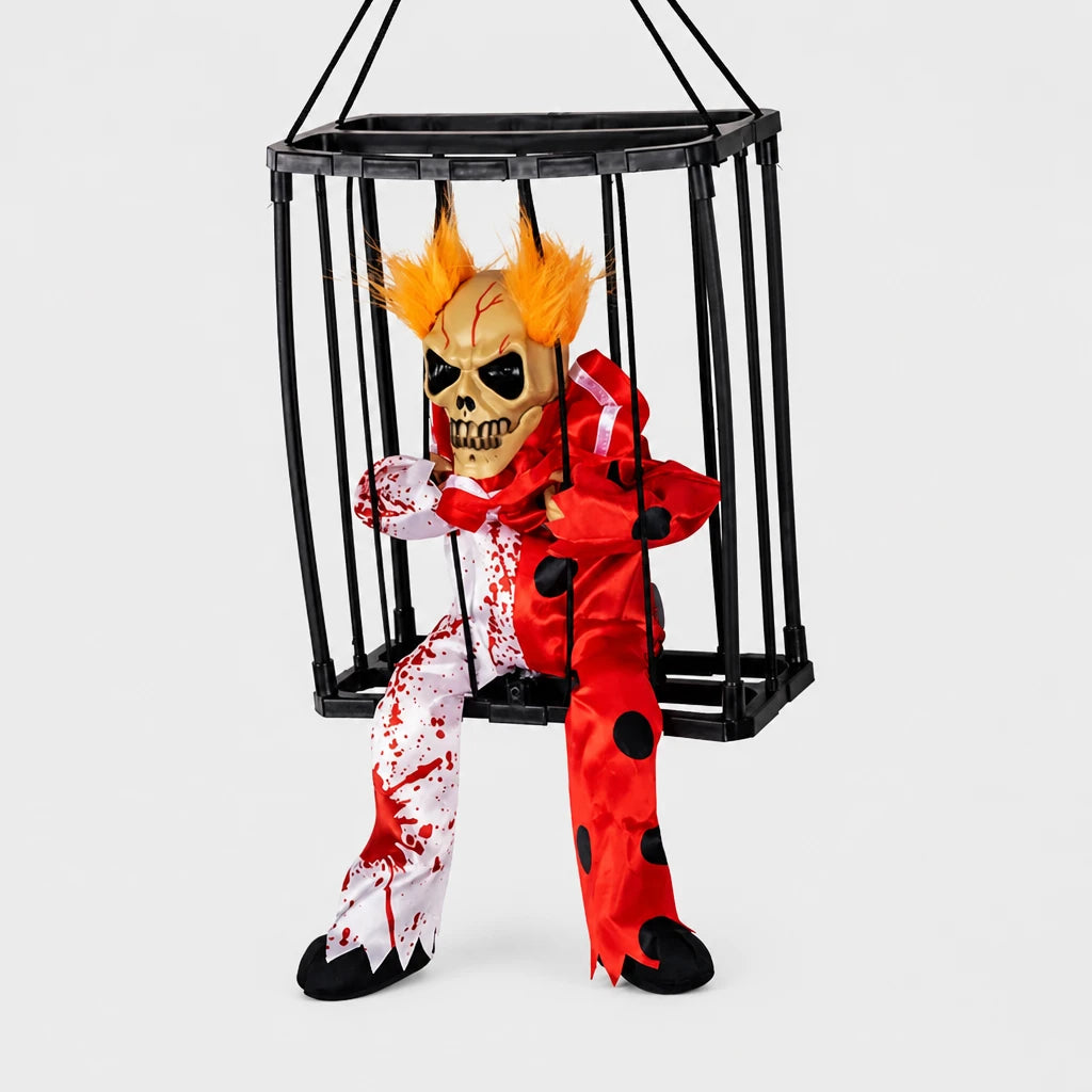 Croakley caged skeleton prop in orange spiked-hair killer clown costume design on a plain studio background