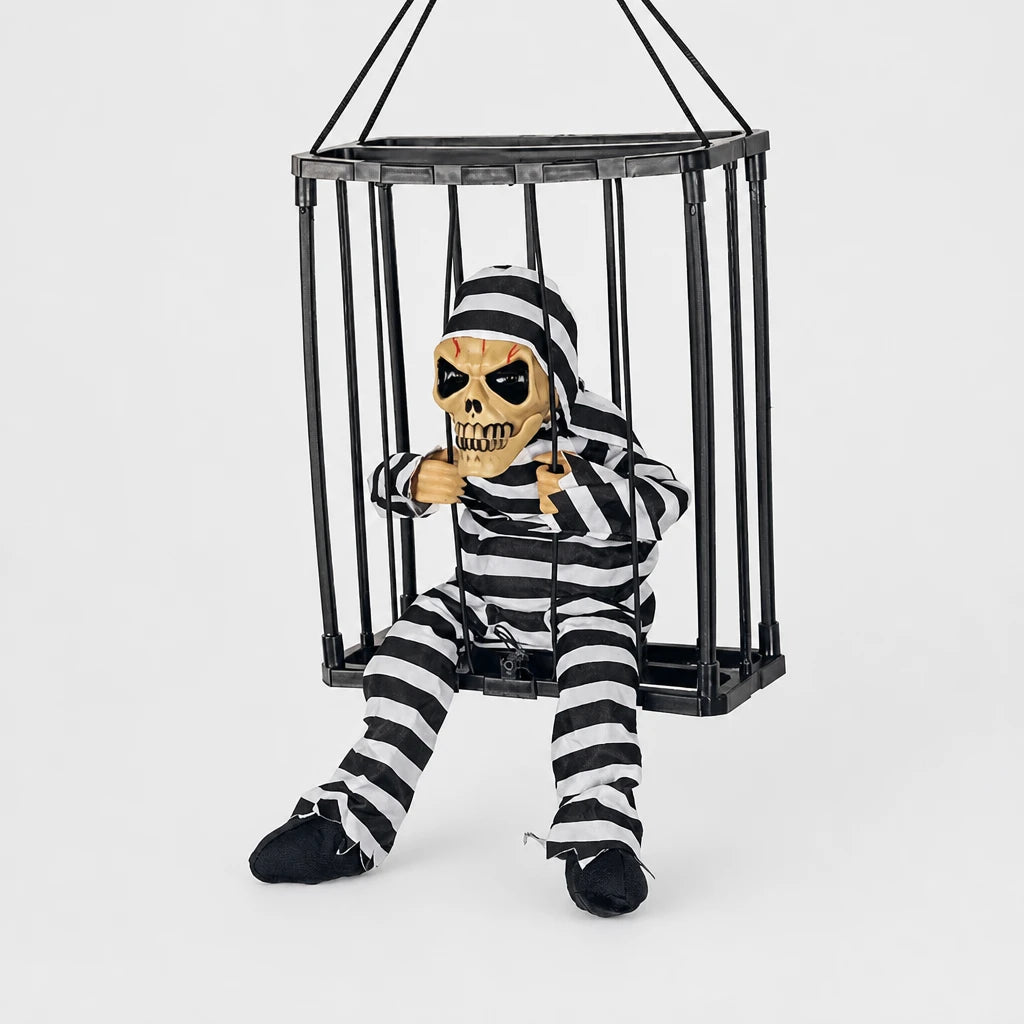 Croakley caged skeleton prop in black and white striped prisoner costume design on a plain studio background