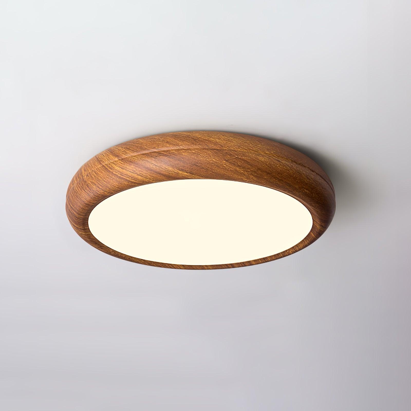 Angled view of the curved walnut wood-effect LED ceiling lamp