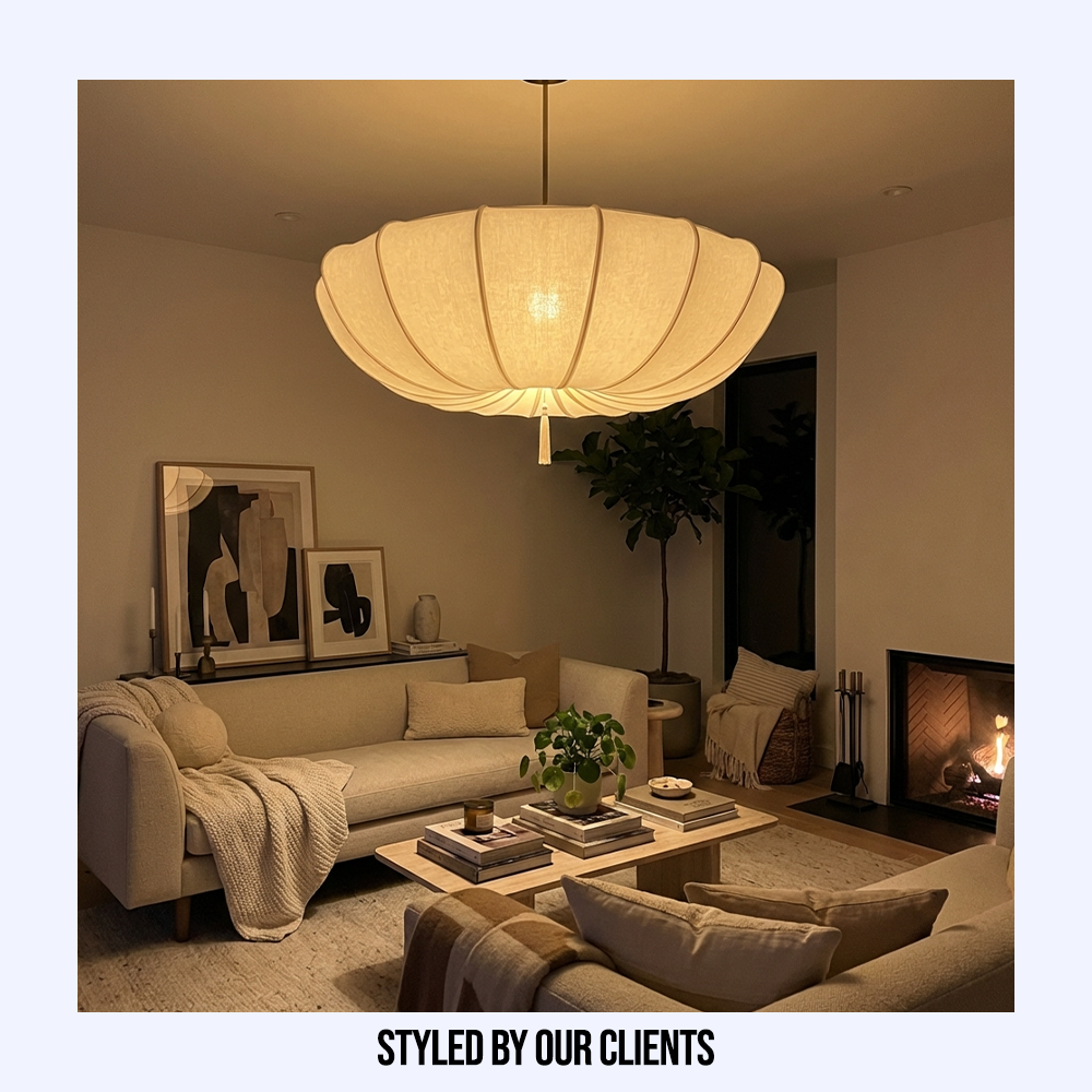 Customer styled organic fabric pendant casting a warm, inviting glow over a cosy living room seating area