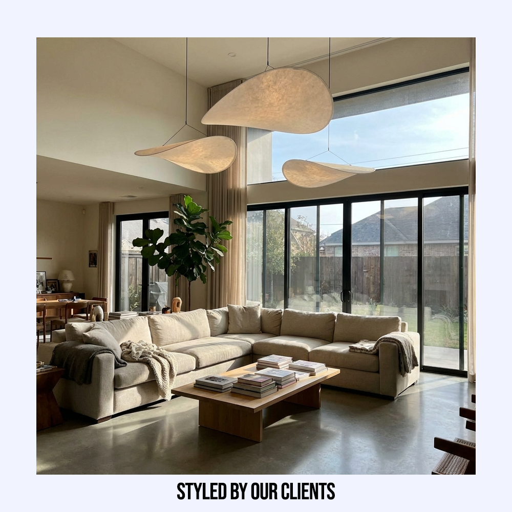 Customer styled Japanese silk wave pendant lights hanging elegantly in a spacious, modern living room