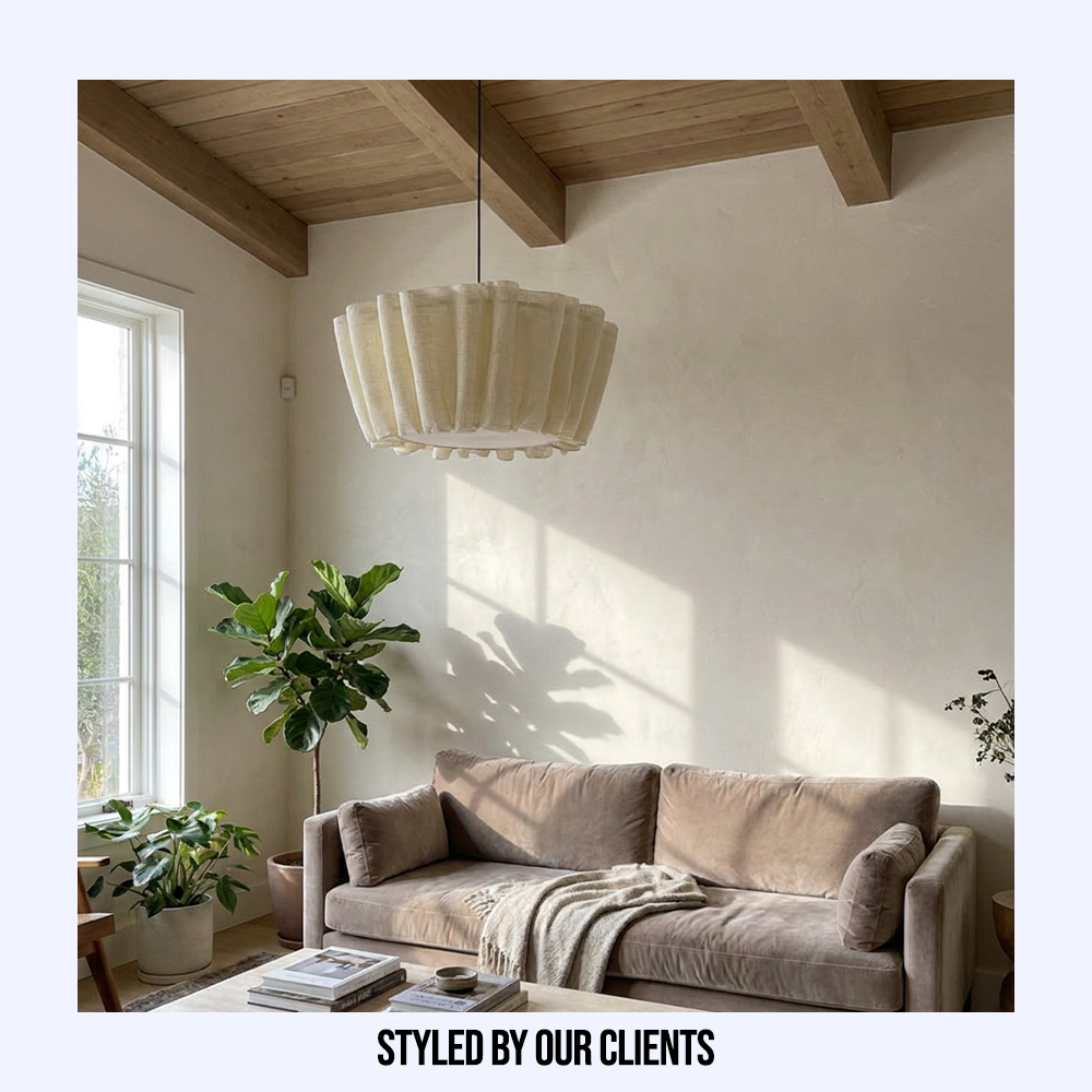 Customer styled Wabi-Sabi pleated fabric pendant light hanging elegantly in a sunlit living room
