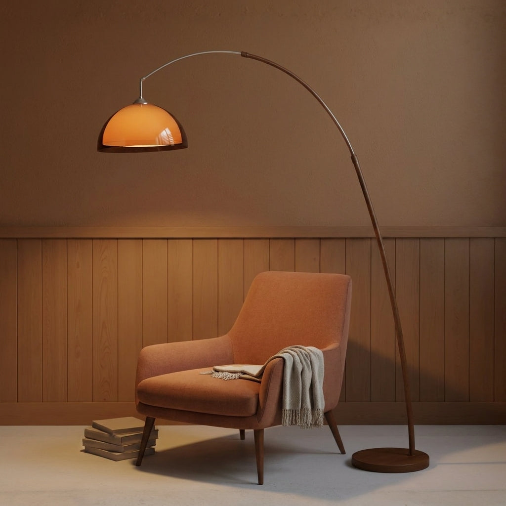 Dalzi arc floor lamp beside an armchair with a throw blanket and stacked books